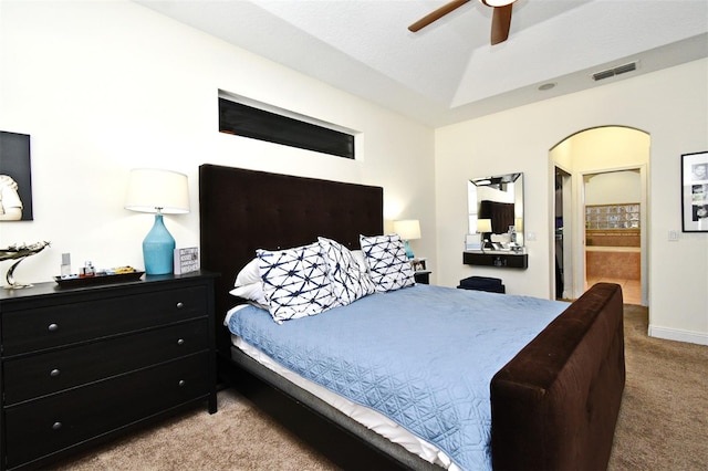 436 Skyview Pl, Chuluota, FL 32766 - bedroom featuring light colored carpet, ceiling fan, arched walkways, and ensuite bathroom