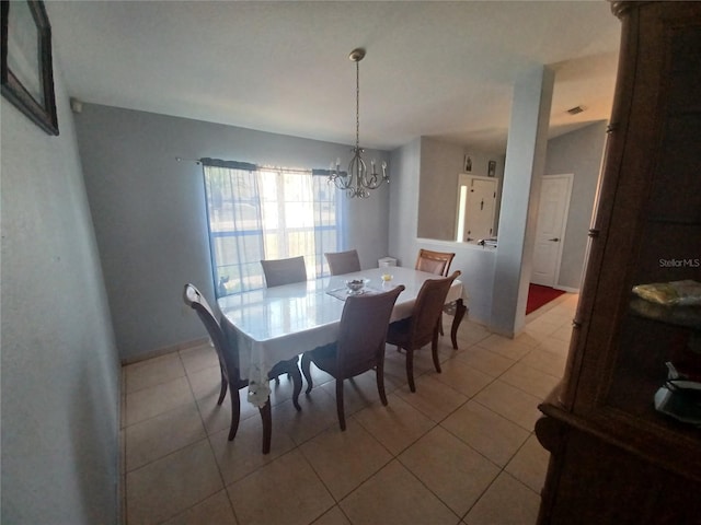 8509 SW 136th Loop, Ocala, FL 34473 - dining area with light tile patterned flooring and a chandelier