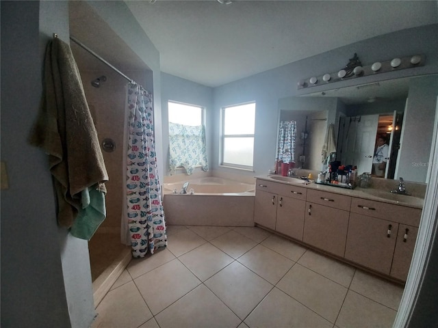 8509 SW 136th Loop, Ocala, FL 34473 - full bathroom featuring double vanity, a garden tub, a tile shower, and tile patterned flooring