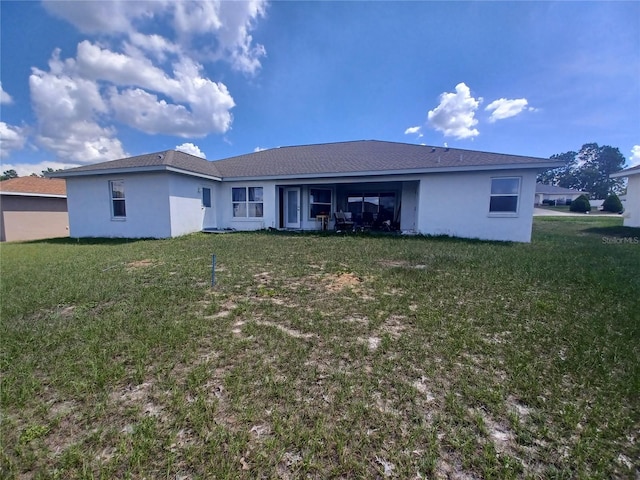 8509 SW 136th Loop, Ocala, FL 34473 - back of property with stucco siding and a yard