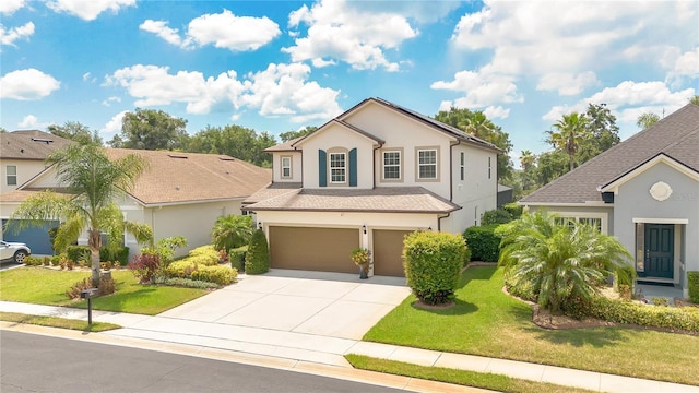 561 Gunston Ct, Davenport, FL 33837 - traditional-style house with driveway, a garage, stucco siding, and a front yard
