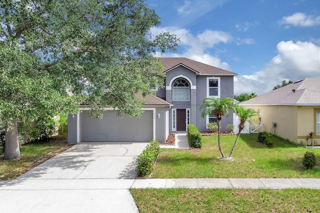 16053 Wilkinson Dr, Clermont, FL 34714 - view of front of home featuring stucco siding, an attached garage, driveway, a front yard, and roof with shingles