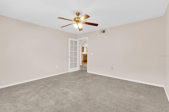 16053 Wilkinson Dr, Clermont, FL 34714 - carpeted empty room featuring a ceiling fan and arched walkways