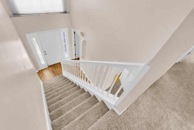 16053 Wilkinson Dr, Clermont, FL 34714 - carpeted entrance foyer with stairway and a towering ceiling