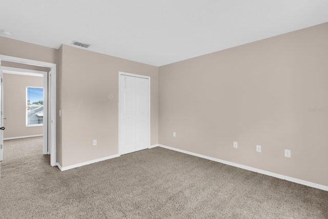 16053 Wilkinson Dr, Clermont, FL 34714 - carpeted empty room with baseboards