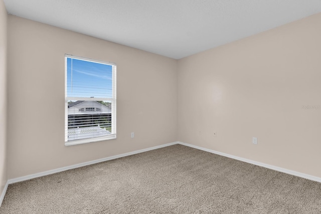16053 Wilkinson Dr, Clermont, FL 34714 - carpeted empty room featuring baseboards