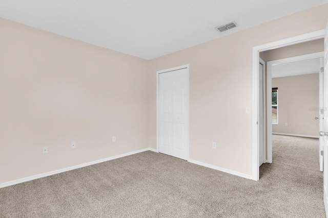 16053 Wilkinson Dr, Clermont, FL 34714 - unfurnished bedroom featuring carpet flooring and baseboards