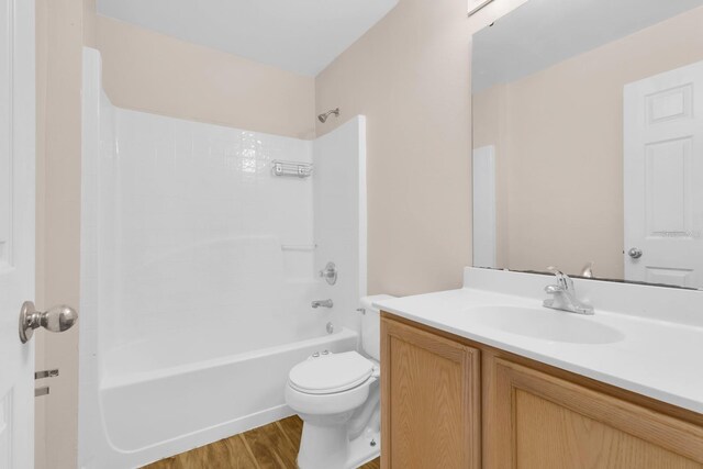 16053 Wilkinson Dr, Clermont, FL 34714 - bathroom featuring vanity, bathtub / shower combination, and wood finished floors