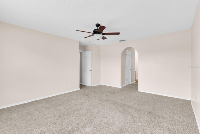 16053 Wilkinson Dr, Clermont, FL 34714 - spare room with ceiling fan, arched walkways, and carpet floors