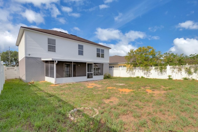 16053 Wilkinson Dr, Clermont, FL 34714 - rear view of property with a sunroom and a fenced backyard