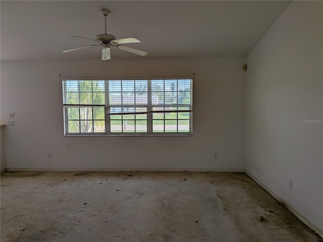 1140 Belmar Ave, Port Charlotte, FL 33948 - empty room with a ceiling fan and light carpet