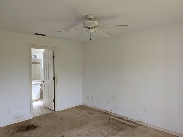 1140 Belmar Ave, Port Charlotte, FL 33948 - empty room with carpet flooring and ceiling fan