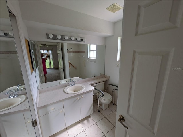 1140 Belmar Ave, Port Charlotte, FL 33948 - bathroom featuring vanity, ceiling fan, and tile patterned floors