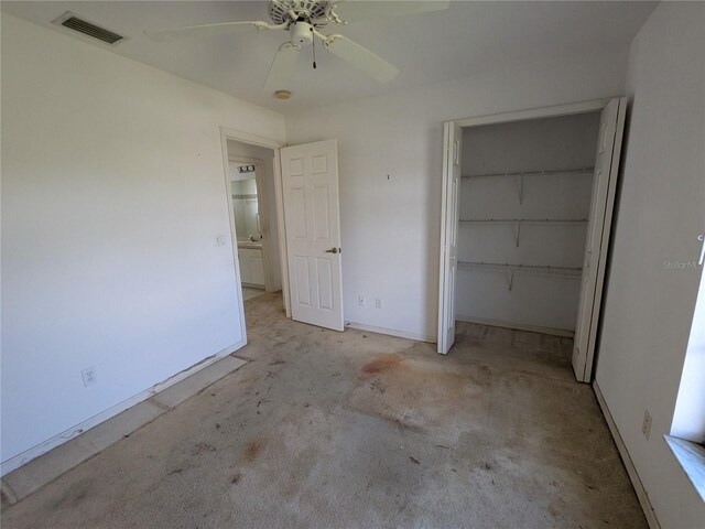 1140 Belmar Ave, Port Charlotte, FL 33948 - unfurnished bedroom with carpet floors, a closet, and a ceiling fan