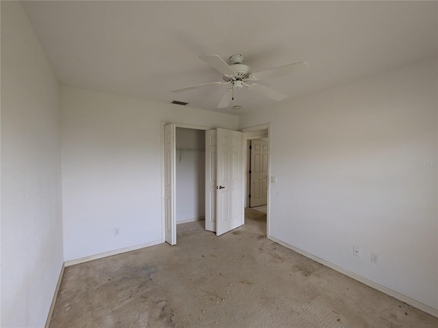 1140 Belmar Ave, Port Charlotte, FL 33948 - unfurnished bedroom featuring a closet, light colored carpet, and a ceiling fan
