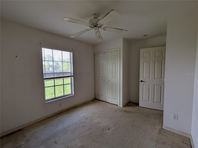 1140 Belmar Ave, Port Charlotte, FL 33948 - unfurnished bedroom with carpet floors, a closet, and ceiling fan