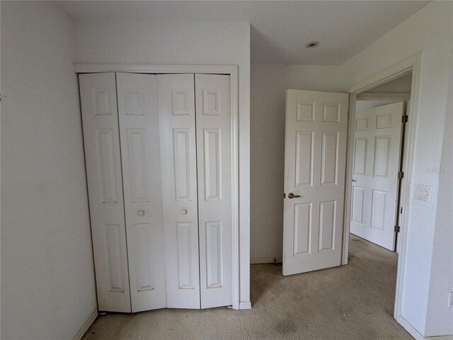 1140 Belmar Ave, Port Charlotte, FL 33948 - unfurnished bedroom featuring carpet floors and a closet