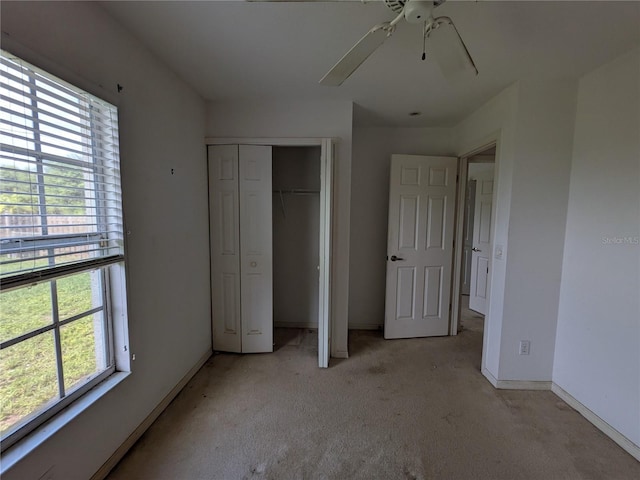 1140 Belmar Ave, Port Charlotte, FL 33948 - unfurnished bedroom featuring light colored carpet, a closet, and ceiling fan
