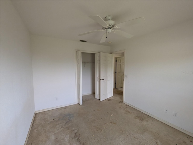 1140 Belmar Ave, Port Charlotte, FL 33948 - unfurnished bedroom featuring light carpet, a closet, and ceiling fan
