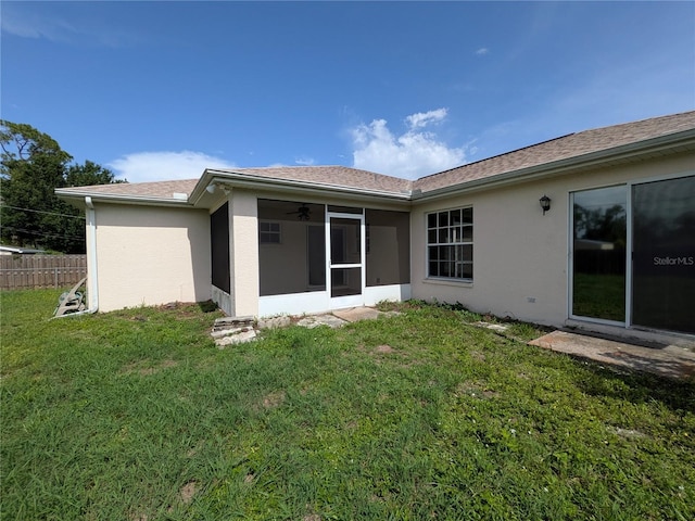 1140 Belmar Ave, Port Charlotte, FL 33948 - back of house with a sunroom and stucco siding