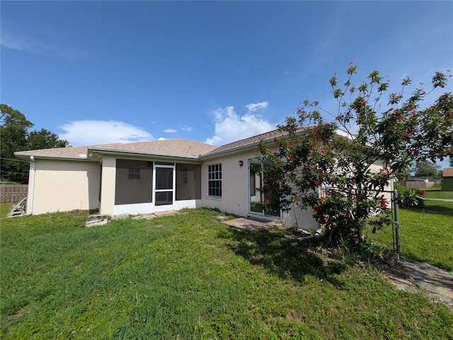 1140 Belmar Ave, Port Charlotte, FL 33948 - back of property featuring stucco siding and a sunroom
