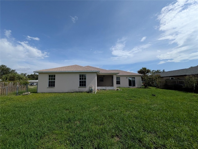 1140 Belmar Ave, Port Charlotte, FL 33948 - rear view of house featuring stucco siding