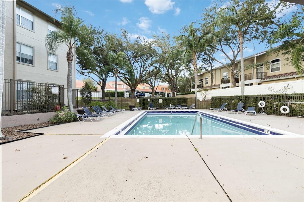 958 Salt Pond Pl Unit 103, Altamonte Springs, FL 32714 - community pool with a patio and a residential view
