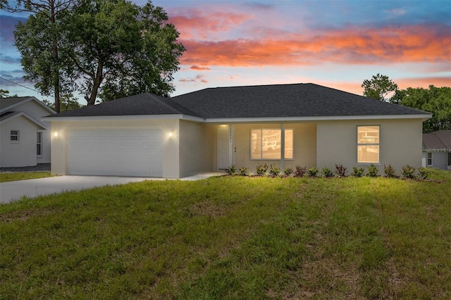 13031 NE 7th Loop, Silver Springs, FL 34488 - single story home with an attached garage, a front lawn, concrete driveway, a shingled roof, and stucco siding