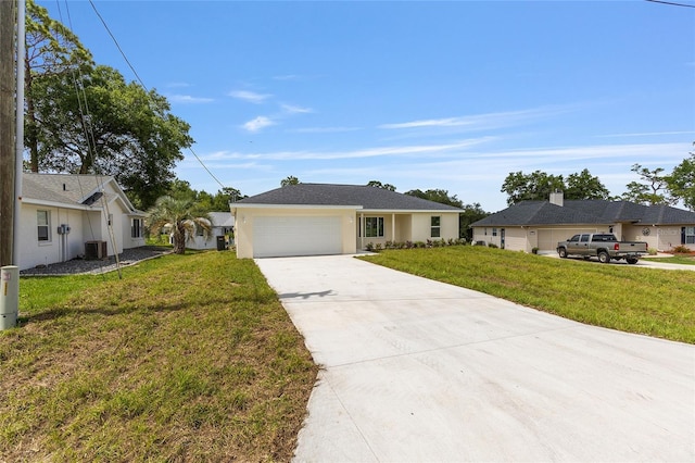 13031 NE 7th Loop, Silver Springs, FL 34488 - ranch-style house with concrete driveway, a garage, a front lawn, and stucco siding