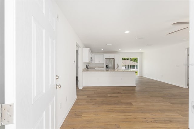 13031 NE 7th Loop, Silver Springs, FL 34488 - unfurnished living room featuring light wood-type flooring, recessed lighting, and ceiling fan