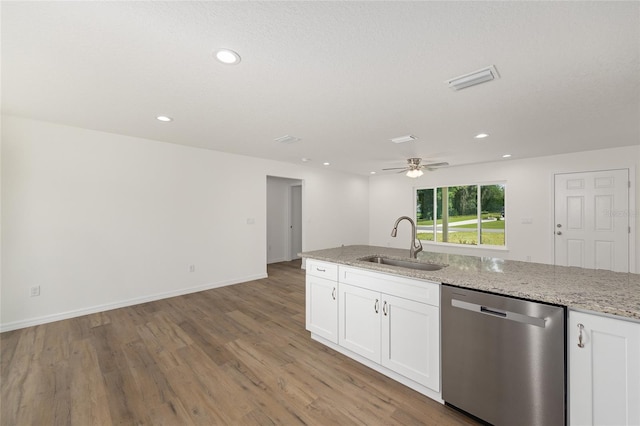 13031 NE 7th Loop, Silver Springs, FL 34488 - kitchen with dishwasher, light wood-type flooring, white cabinetry, a ceiling fan, and recessed lighting