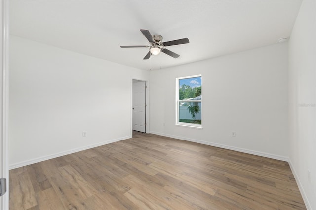 13031 NE 7th Loop, Silver Springs, FL 34488 - spare room with light wood-style floors and ceiling fan