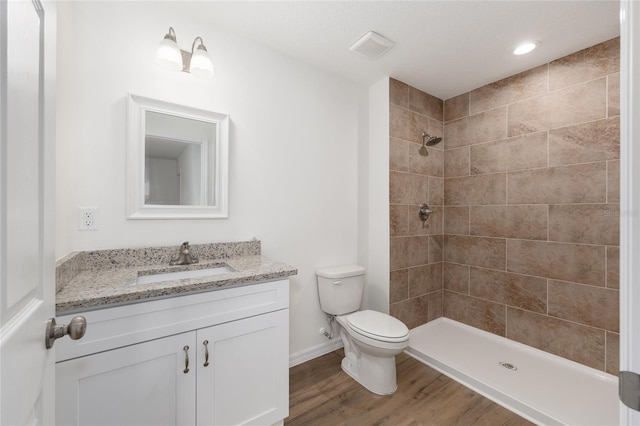 13031 NE 7th Loop, Silver Springs, FL 34488 - full bath featuring vanity, wood finished floors, and tiled shower