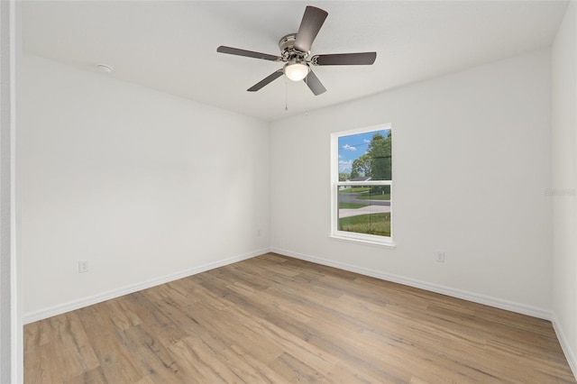 13031 NE 7th Loop, Silver Springs, FL 34488 - empty room with light wood-style flooring and a ceiling fan