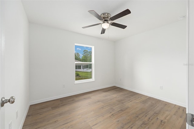 13031 NE 7th Loop, Silver Springs, FL 34488 - empty room featuring light wood-style flooring and ceiling fan