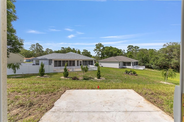 13031 NE 7th Loop, Silver Springs, FL 34488 - view of front of home with a sunroom and a patio