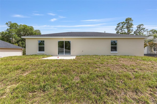 13031 NE 7th Loop, Silver Springs, FL 34488 - back of property featuring stucco siding and a yard