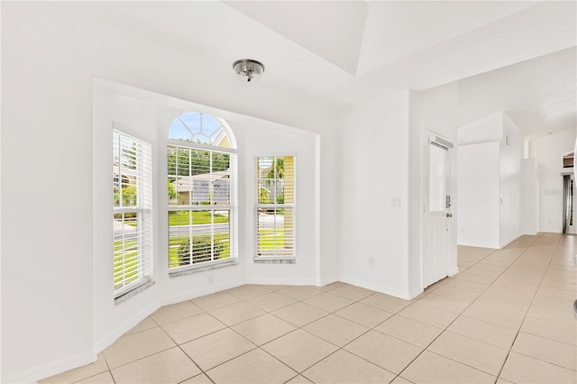 9003 Pecky Cypress Way, Orlando, FL 32836 - empty room with light tile patterned floors and baseboards