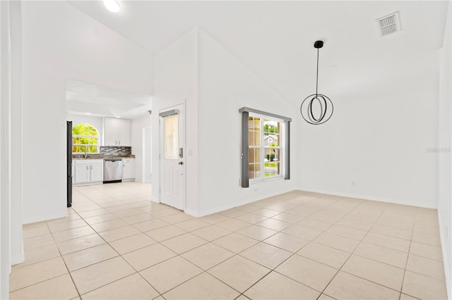 9003 Pecky Cypress Way, Orlando, FL 32836 - unfurnished living room featuring light tile patterned flooring and high vaulted ceiling