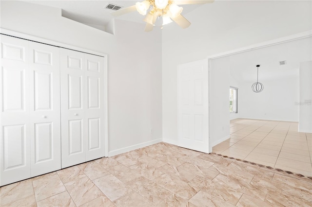 9003 Pecky Cypress Way, Orlando, FL 32836 - unfurnished bedroom with a closet, a towering ceiling, and ceiling fan