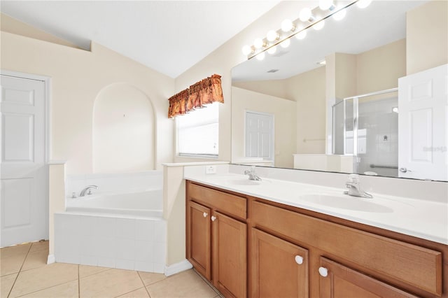 9003 Pecky Cypress Way, Orlando, FL 32836 - full bath featuring tile patterned flooring, a stall shower, double vanity, and a bath