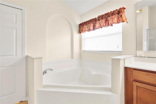 9003 Pecky Cypress Way, Orlando, FL 32836 - bathroom with vanity and a garden tub