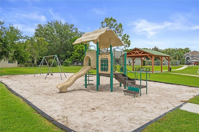 9003 Pecky Cypress Way, Orlando, FL 32836 - communal playground featuring a lawn