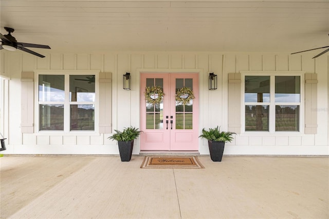 2212 SW 210th Ave, Dunnellon, FL 34431 - doorway to property with french doors, ceiling fan, a porch, and board and batten siding