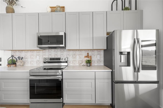 2212 SW 210th Ave, Dunnellon, FL 34431 - kitchen featuring stainless steel appliances, light countertops, and decorative backsplash