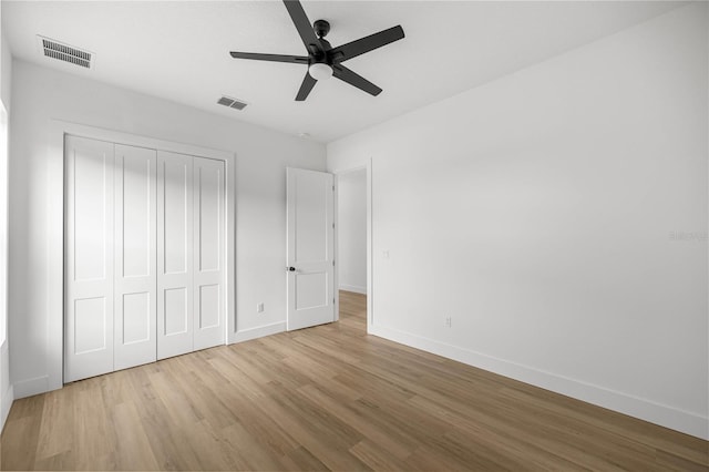 2212 SW 210th Ave, Dunnellon, FL 34431 - unfurnished bedroom featuring wood finished floors, a closet, and ceiling fan