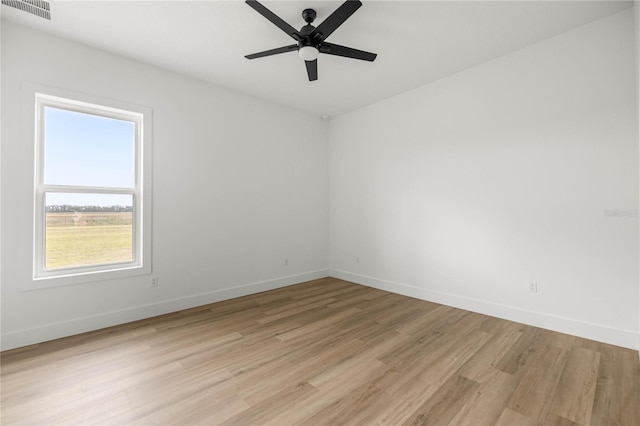 2212 SW 210th Ave, Dunnellon, FL 34431 - empty room with light wood finished floors and ceiling fan