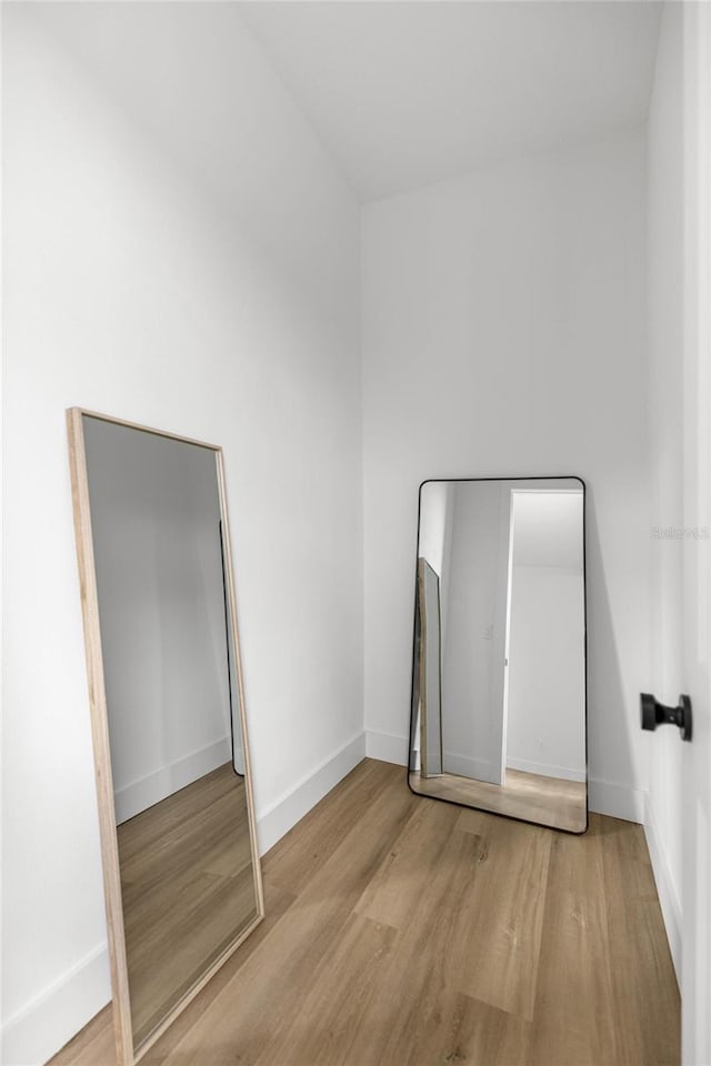 2212 SW 210th Ave, Dunnellon, FL 34431 - unfurnished bedroom with wood finished floors and baseboards