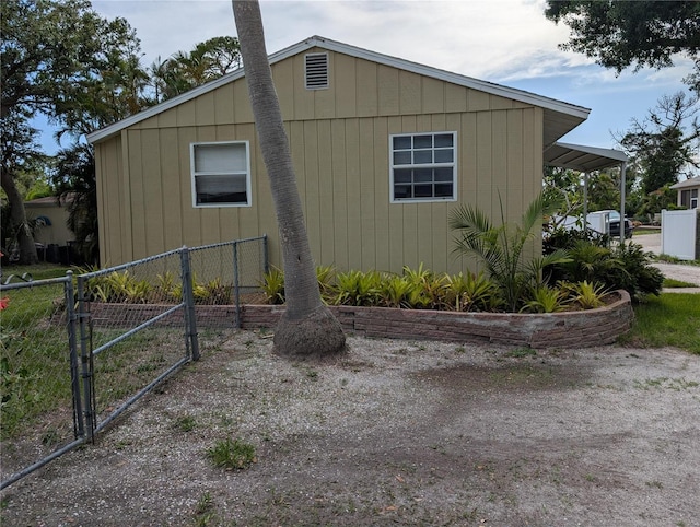 417 Shore Rd, Nokomis, FL 34275 - view of side of property with a gate