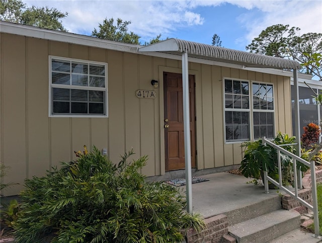 417 Shore Rd, Nokomis, FL 34275 - doorway to property featuring board and batten siding